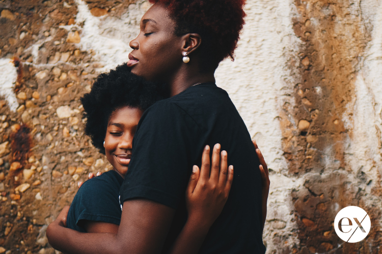 mother-embracing-daughter